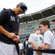 Aaron Judge #99 of the New York Yankees signs a autograph for a fan prior to the Grapefruit League spring training game against the Philadelphia Phillies at Steinbrenner Field on February 26, 2019 in Tampa, Florida.